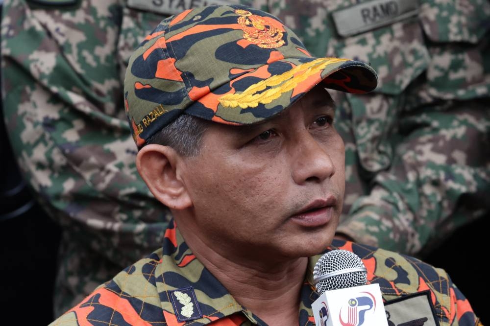 Selangor Fire and Rescue Department deputy director Wan Md Razali Wan Md Ismail speaks to the media on the latest developments of the search and rescue operation for victims at the camp site at Father’s Organic Farm, Batang Kali, December 20, 2022. — Bernama pic 