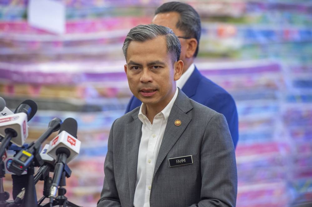 Communications and Digital Minister Fahmi Fadzil speaks to the media during a press conference on flood aid preparation at his ministry in Putrajaya, December 21, 2022. — Picture by Shafwan Zaidon