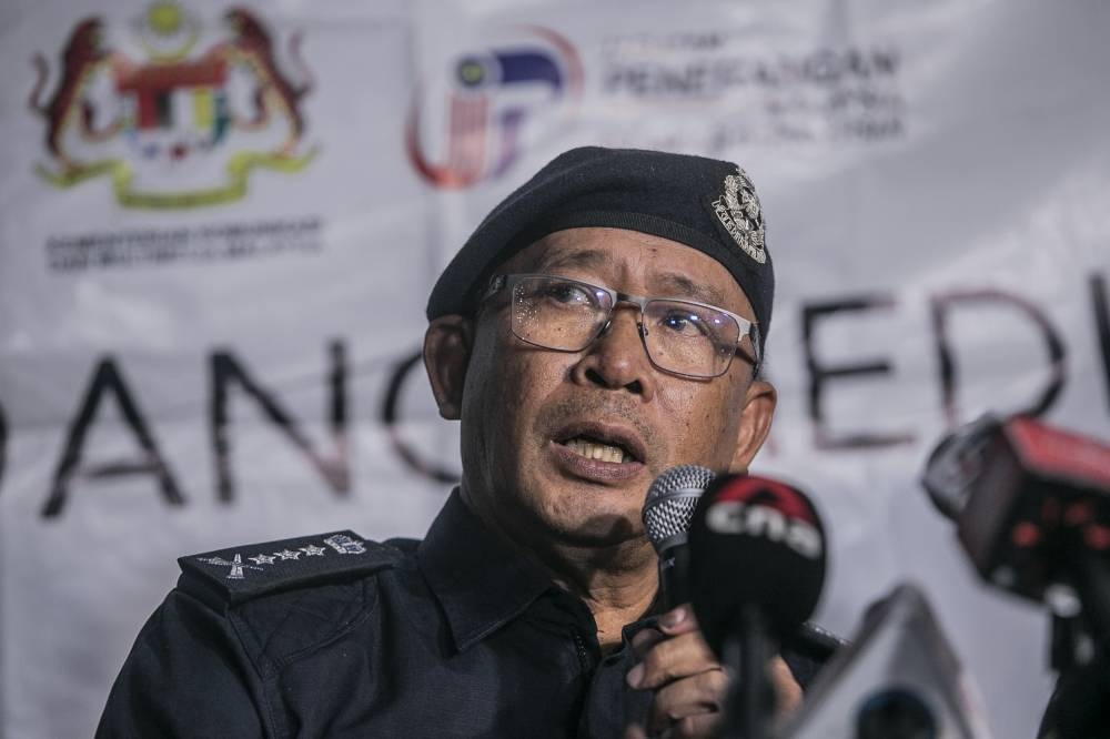 Selangor police chief Datuk Arjunaidi Mohamed speaks to the media during a press conference at the Father’s Organic Farm campsite, Batang Kali, December 22, 2022. — Picture by Hari Anggara