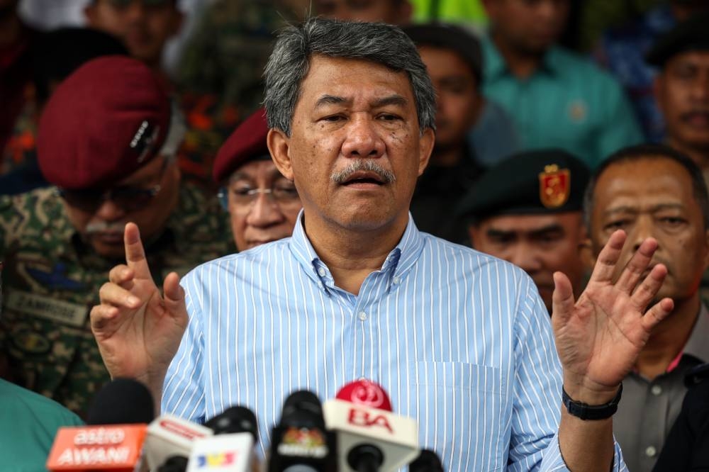 Defence Minister Datuk Seri Mohamad Hasan speaks during a press conference after visiting the flood victims at the relief centre (PPS) at Sekolah Kebangsaan Banggol Peradong in Kuala Terengganu December 23, 2022. — Bernama pic