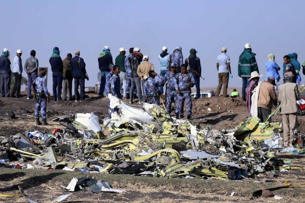 Ethiopian Federal policemen stand at the scene of the Ethiopian Airlines Flight ET 302 plane crash, near the town of Bishoftu Ethiopia, March 11, 2019. — Reuters pic