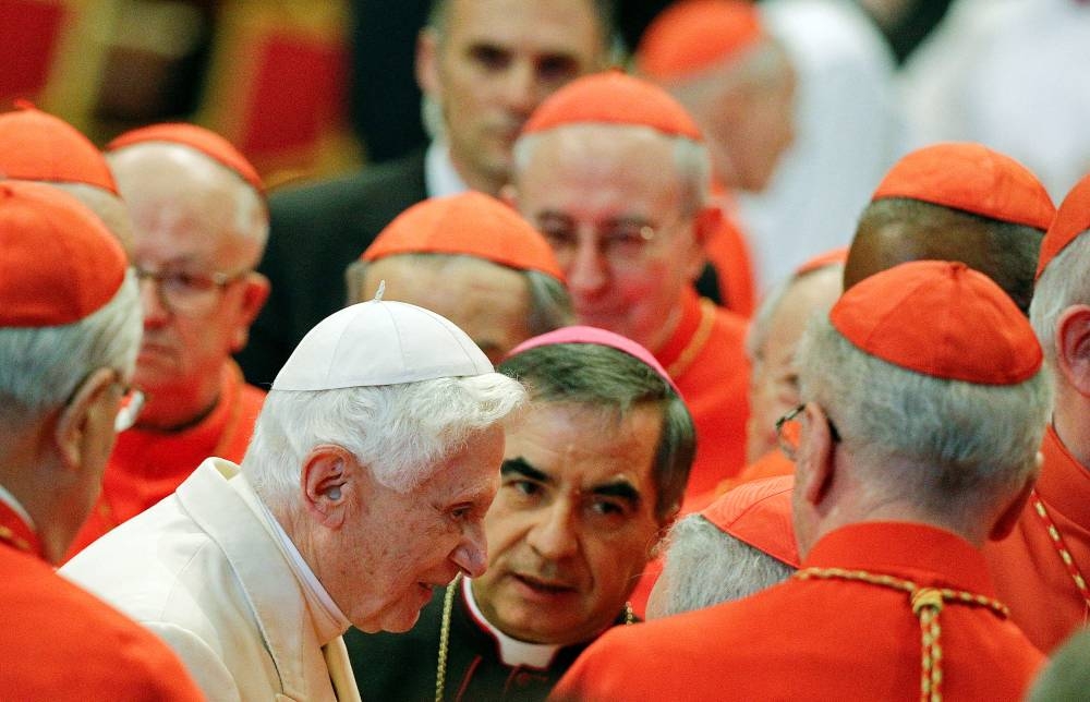 Pope Emeritus Benedict XVI is greeted by Cardinals as he arrives to attend a consistory ceremony in Saint Peter’s Basilica at the Vatican February 22, 2014. — Reuters pic