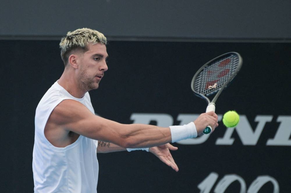 Australian tennis player Thanasi Kokkinakis attends a practice session ahead of the ATP Adelaide International tournament in Adelaide on December 31, 2022. — AFP pic