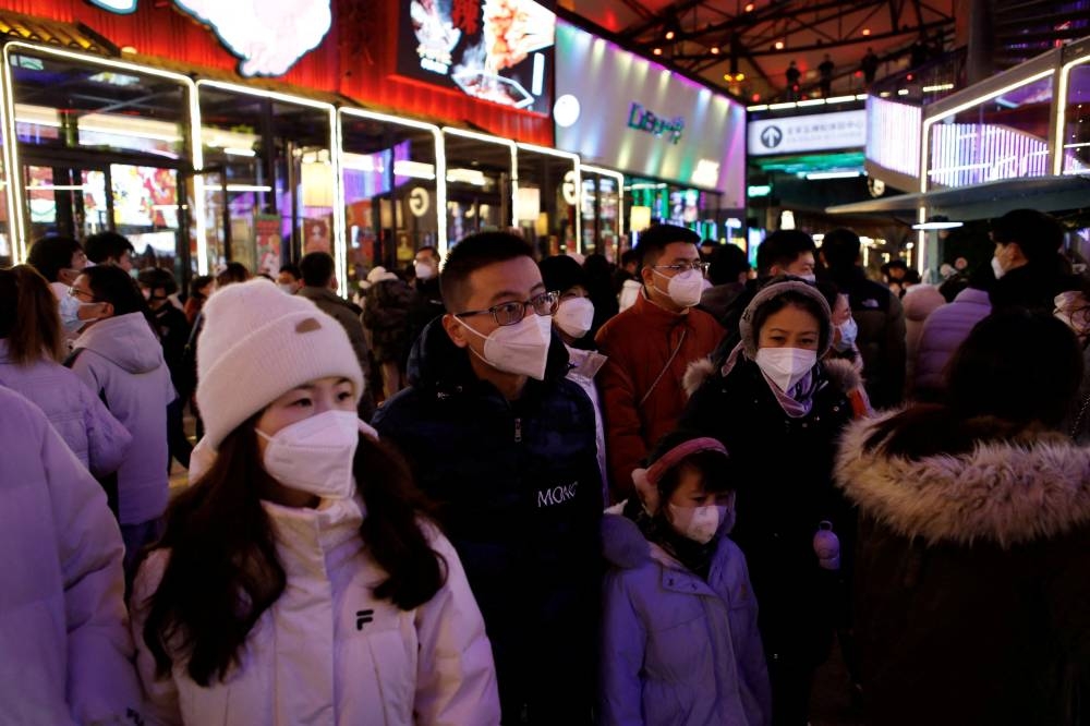 Visitors throng a shopping complex on New Year's Eve, amid the Covid-19 outbreak in Beijing, China December 31, 2022. — Reuters pic