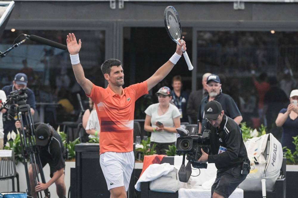 Serbian tennis player Novak Djokovic celebrates after winning his first round match against France's Constant Lestienne at the ATP Adelaide International tournament in Adelaide on January 3, 2023. — AFP pic