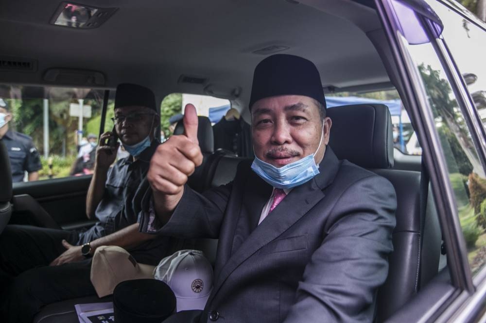 Datuk Seri Dr Joachim Gunsalam and Datuk Ellron Angin said their parties were firmly behind Hajiji (pic). — Picture by Firdaus Latif.