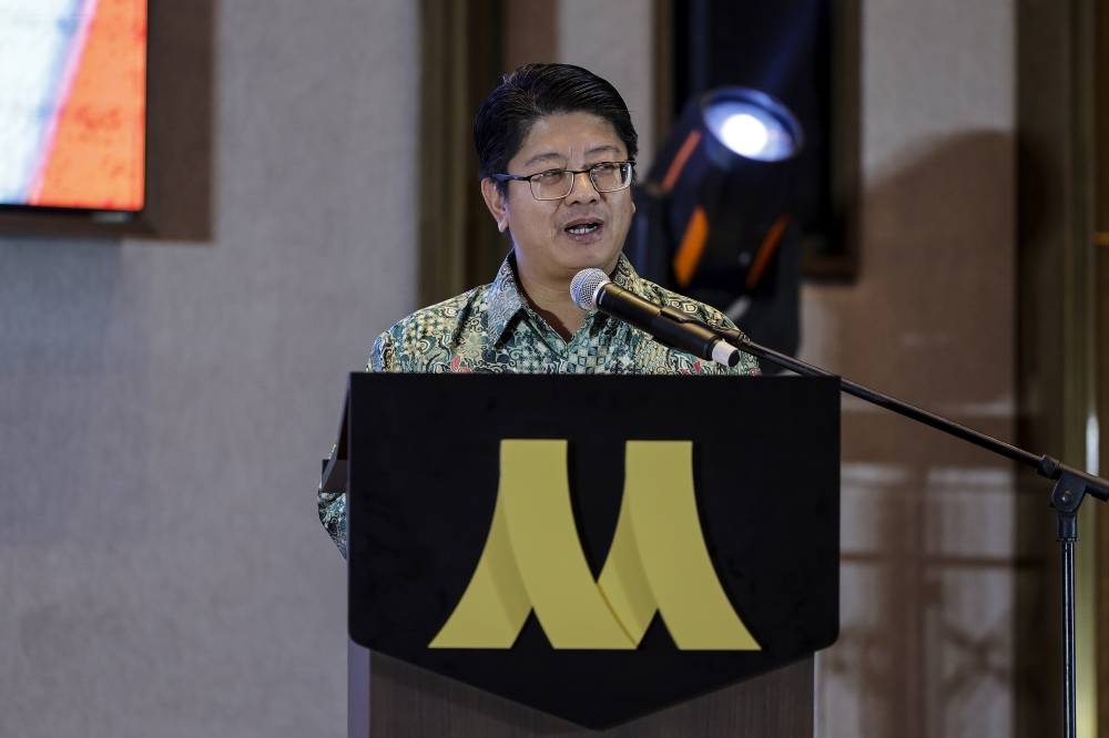 Entrepreneur Development and Cooperatives Minister Datuk Ewon Benedick speaking at the launching ceremony of Malaysia's first online cooperative application, TAPTAPLAH, in Kuala Lumpur, December 25, 2022. — Bernama pic