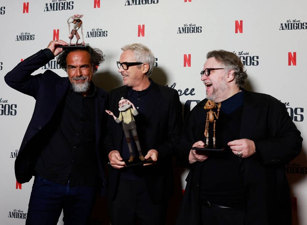 Mexican filmmakers Alfonso Cuaron (left), Alejandro Gonzalez Inarritu (centre) and Guillermo del Toro (right) attend Netflix’s ‘Three Amigos in Conversation’ at David Geffen Theatre at The Academy Museum on January 6, 2023 in Los Angeles. — AFP pic