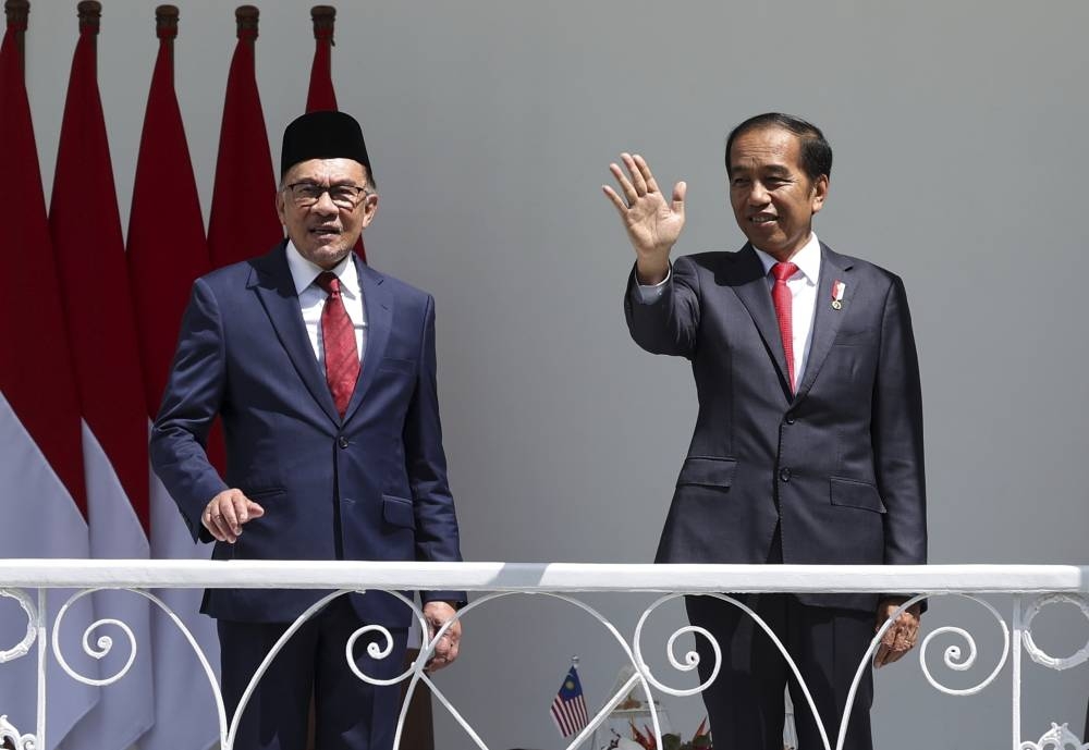 Prime Minister Datuk Seri Anwar Ibrahim (left) with Indonesian President Joko Widodo on the veranda of Bogor Presidential Palace before their bilateral meeting in Bogor January 9, 2023. — Bernama pic