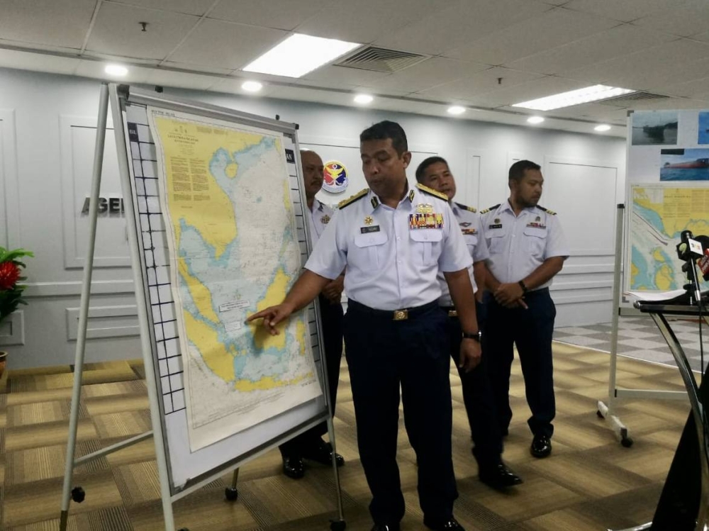 Johor Malaysian Maritime Enforcement Agency (MMEA) director Maritime First Admiral Nurul Hizam Zakaria indicates the last reported location of the missing cargo ship MV Dai Cat 06. — Picture by Ben Tan