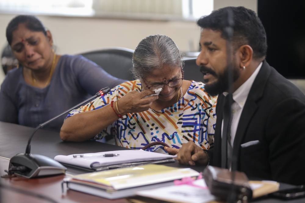 Lawyer Arun Dorasamy and Madam Sumathi filing a request with Suhakam for an inquiry into the disappearance and murder of Vinayagam at Suhakam's headquaters in Kuala Lumpur January 12,2023. — Picture by Ahmad Zamzahuri