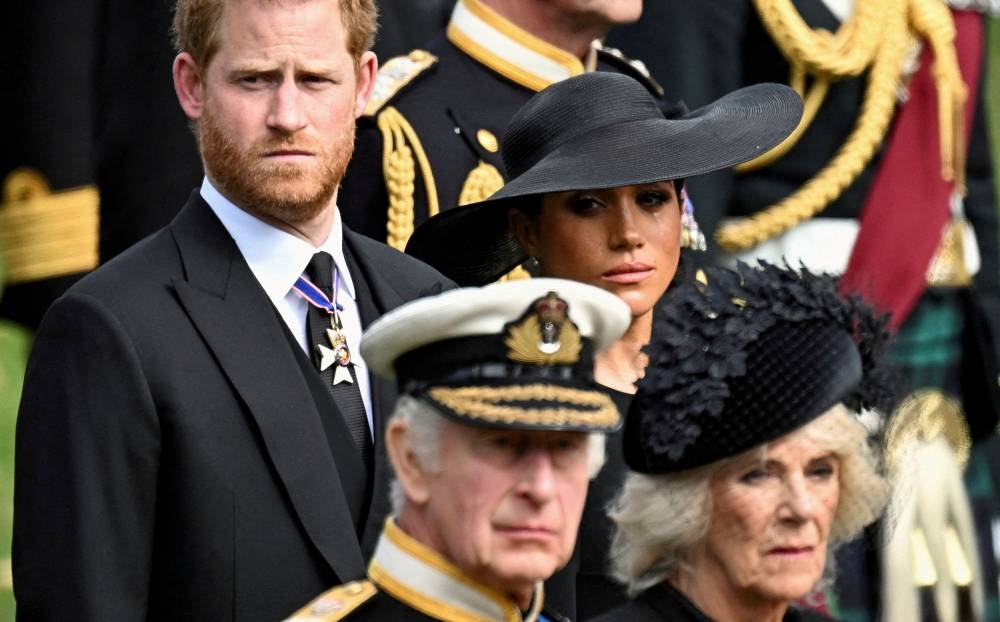 Britain's Meghan, Duchess of Sussex, Prince Harry, Duke of Sussex, Queen Camilla and King Charles attend the state funeral and burial of Britain's Queen Elizabeth, in London September 19, 2022. ― Reuters pic