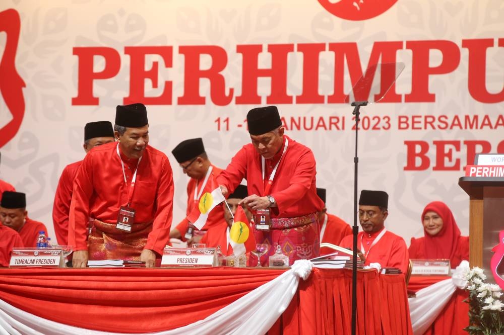 Umno members have decided to allow president Datuk Seri Ahmad Zahid Hamidi and deputy president Datuk Seri Mohd Hasan to continue leading them for the next three years. — Picture by Ahmad Zamzahuri