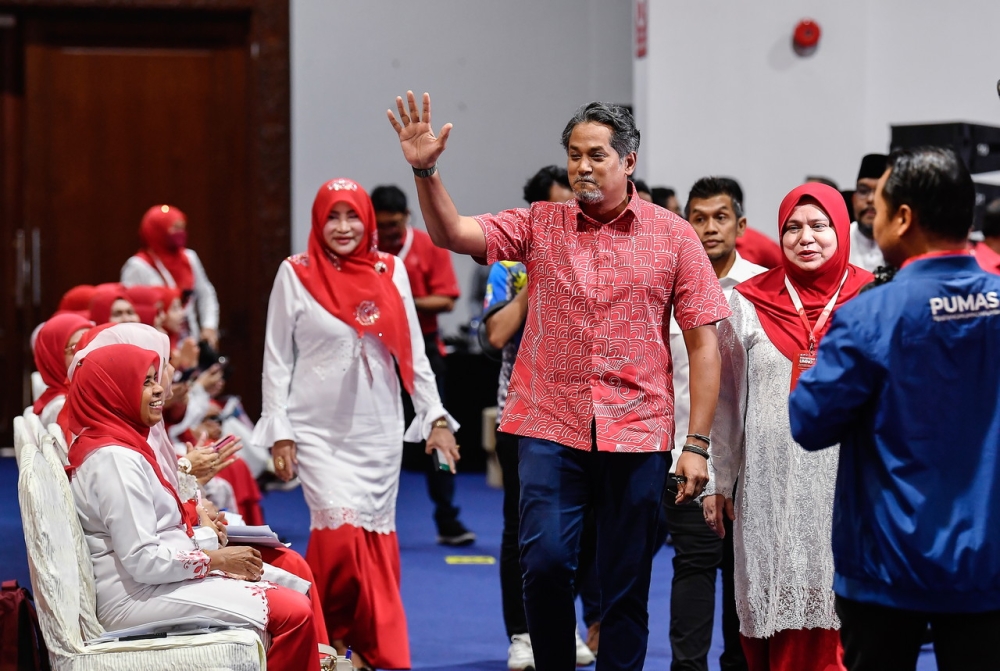 Umno Rembau deputy division chief Khairy Jamaluddin (centre) arrives for the 2022 Umno General Assembly at the Kuala Lumpur World Trade Centre (WTCKL) January 12, 2023. — Bernama pic