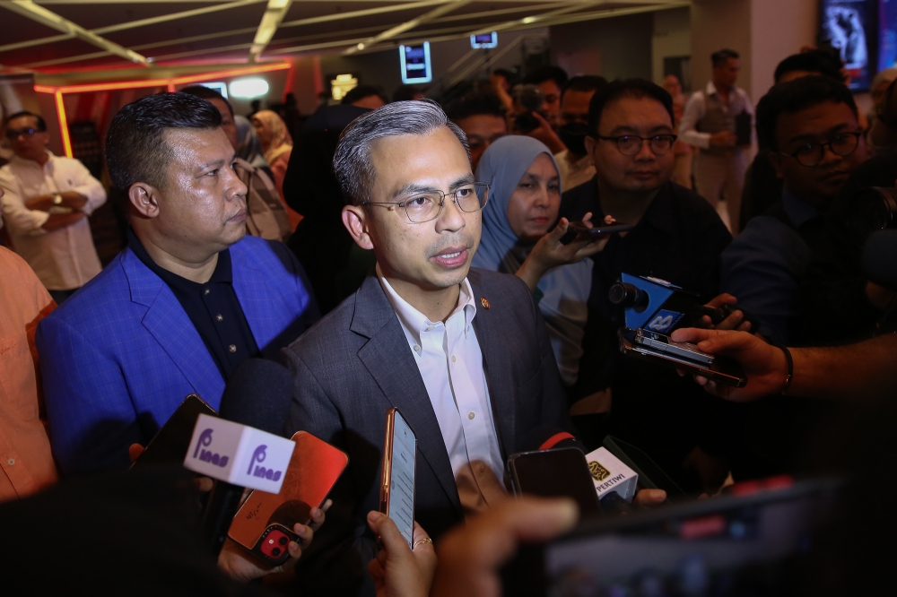 Communications and Digital Minister Fahmi Fadzil speaks to reporters during the exclusive screening of the film 'Duan Nago Bogho' at at Starling Mall in Damansara January 18, 2023. — Picture by Yusof Mat Isa