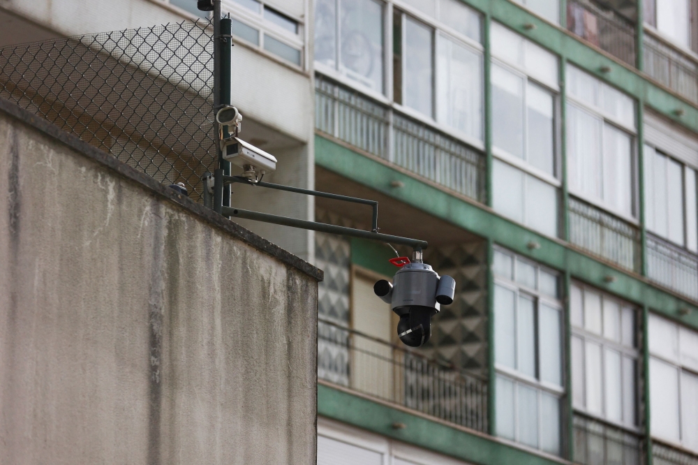 A surveillance camera is seen pointed to the exterior of the Chinese embassy in Lisbon, Portugal, December 21, 2022. — Reuters pic