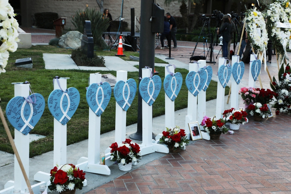 The names of the eleven people killed are written on hearts as people gather for a candlelight vigil after a mass shooting during Chinese Lunar New Year celebrations in Monterey Park, California, U.S. January 24, 2023.  — Reuters pic