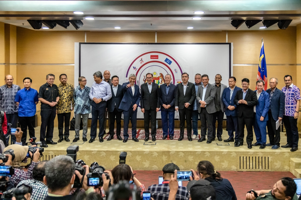 Prime Minister Datuk Seri Anwar Ibrahim and party leaders pose for a photo after the first Unity Government Secretariat meeting at Menara Dato’ Onn in Kuala Lumpur February 7, 2023. — Picture by Firdaus Latif