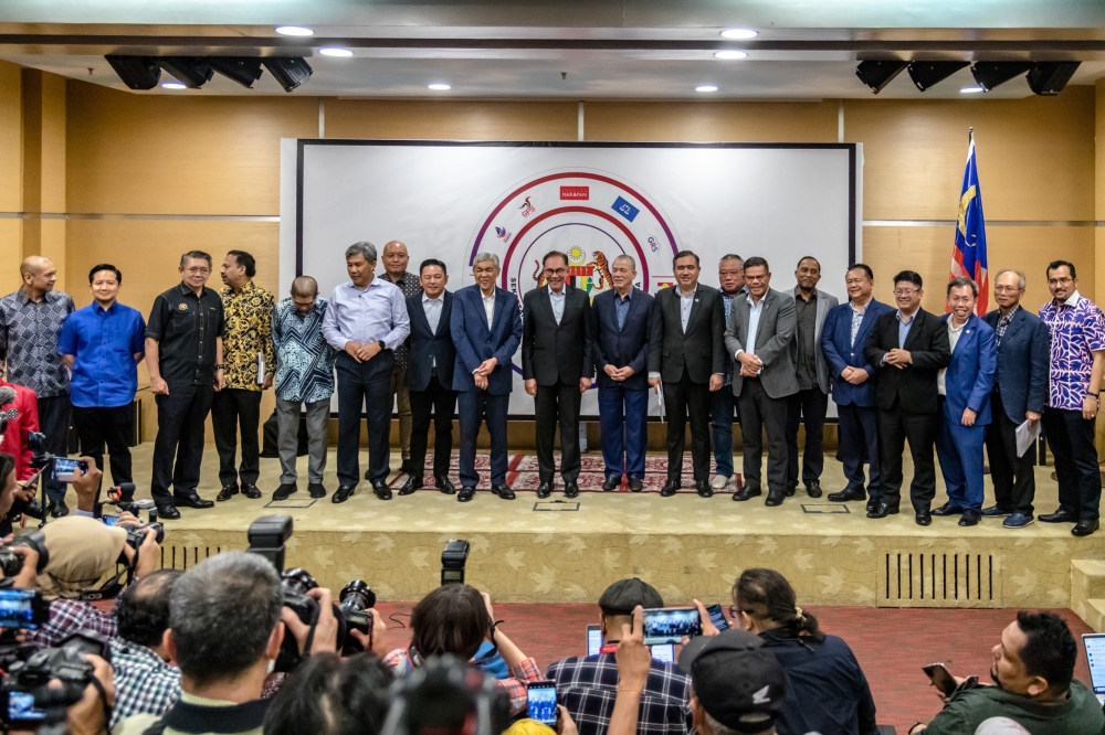 Prime Minister Datuk Seri Anwar Ibrahim with other party leaders pose for a photo after press conferences at the first Unity Government Secretariat meeting at Menara Dato’ Onn in Kuala Lumpur February 7, 2023. ― Picture by Firdaus Latif 