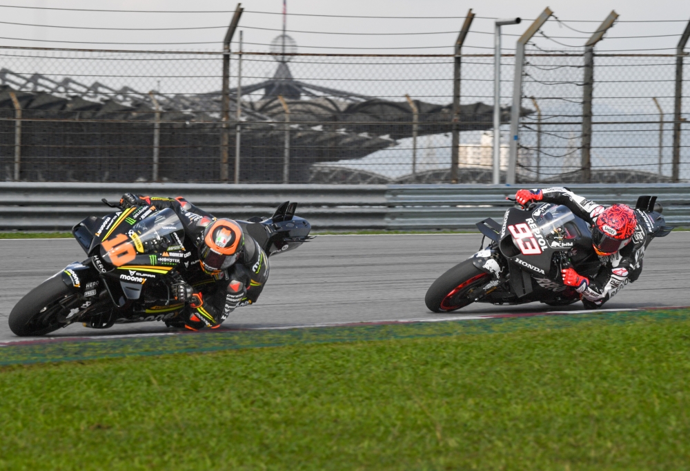 Repsol Honda Team rider Marc Marquez (right) and Mooney VR46 Racing Team rider Luca Marini (left) in action at the 2023 MotoGP Pre-Season Test session at the Sepang International Circuit (SIC) Sepang February 10, 2023. — Bernama pic