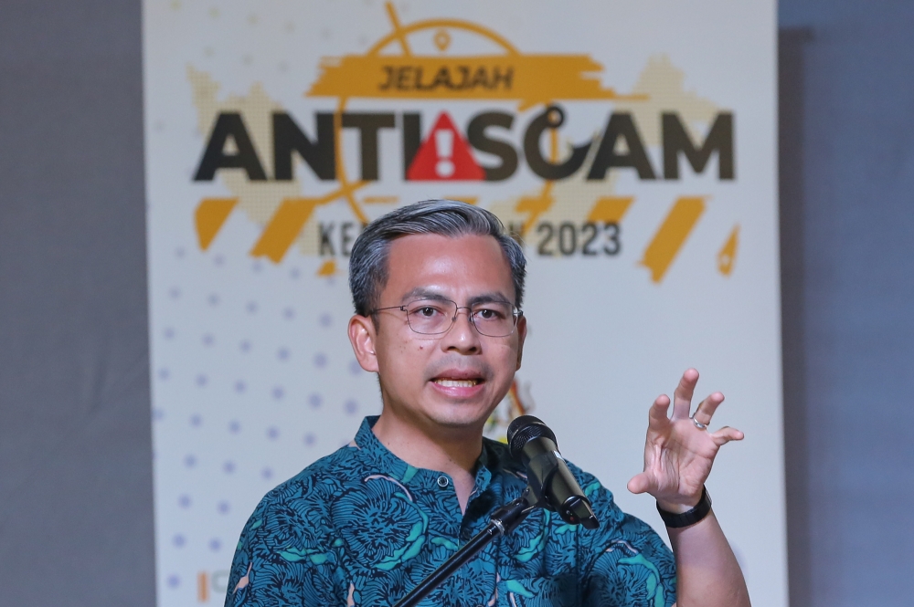 Communications and Digital Minister Fahmi Fadzil speaks during the National Anti-Scam 2023 programme at CelcomDigi Tower in Petaling Jaya, February 18, 2023. — Picture by Yusof Mat Isa