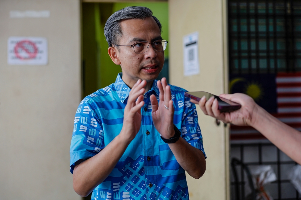 Communications and Digital Minister Fahmi Fadzil speaks to the media after attending Lembah Pantai parliamentary constituency ’Khatan Perdana’ ceremony in Kuala Lumpur February 19, 2023. — Bernama pic