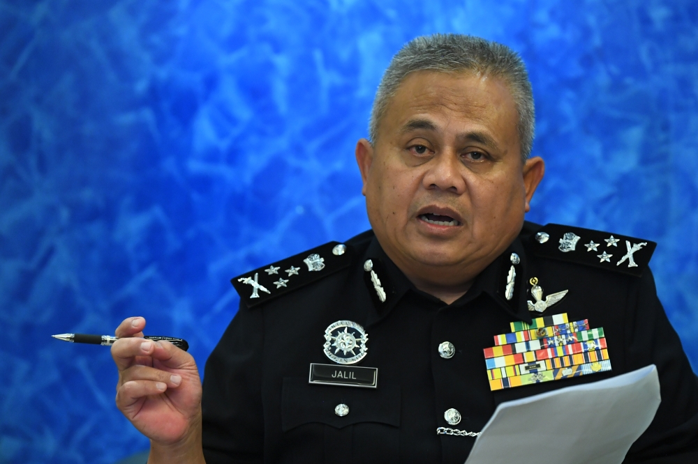 Royal Malaysia Police's Federal Crime Investigation Department director, Datuk Seri Abd Jalil Hassan speaks to the media about Malaysians duped by job scammers in Thailand, at the Kuala Lumpur International Airport (KLIA) in Sepang, February 19, 2023. — Picture by Shafwan Zaidon