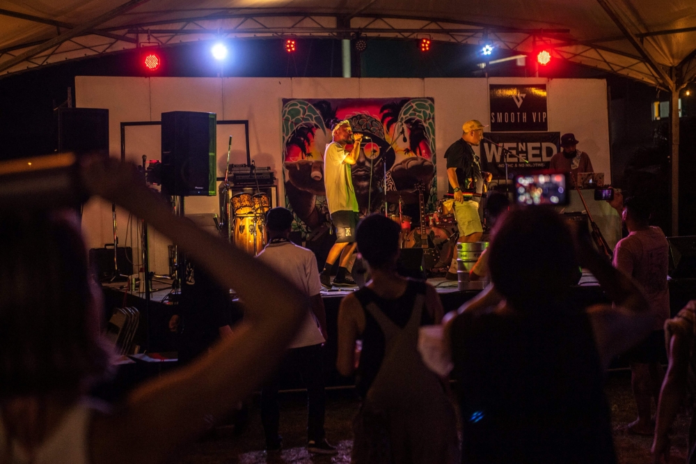 Okinawan hip-hop artist Ritto Maehara performing during a music festival at Naminoue Umisora Park in Naha, in Japan's Okinawa Prefecture August 21, 2022. — AFP pic