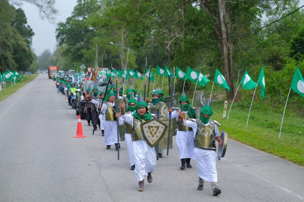 PAS Youth held a parade in which attendees dressed as medieval Arabic warriors brandishing replica swords, spears, bows, and shields. — Picture via social media