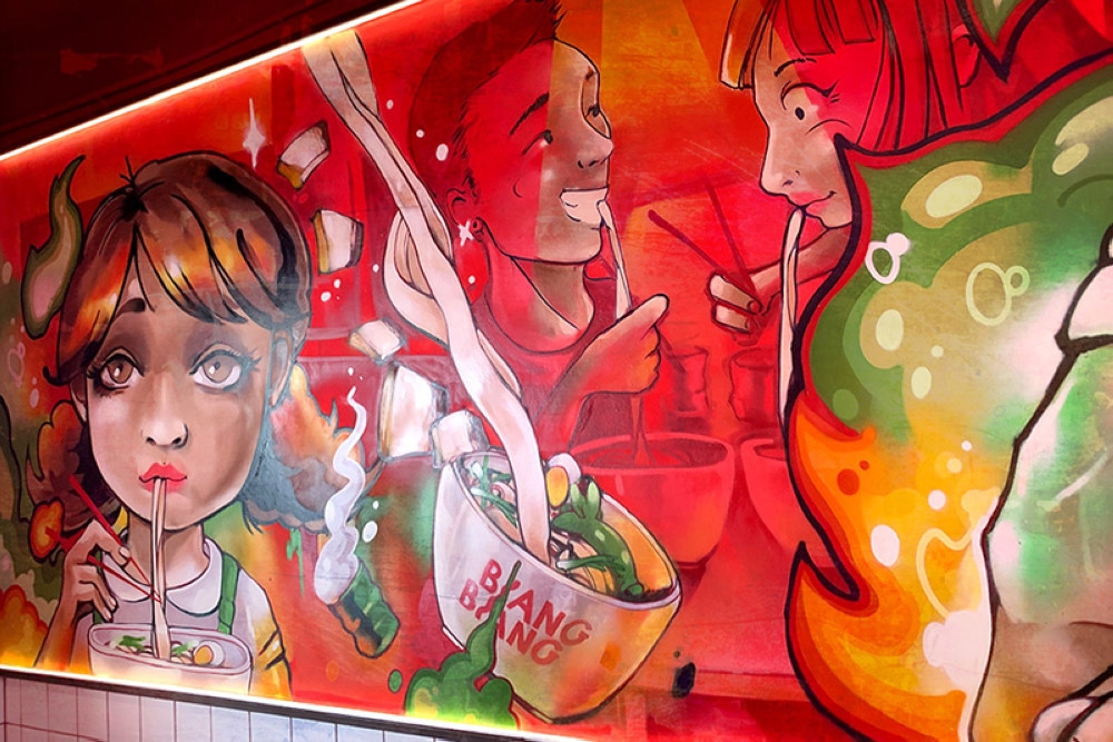 Vibrant and cheeky: The shop’s eye-catching graffiti mural.