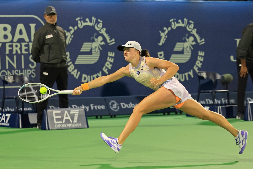 World number one Iga Swiatek swept past Liudmila Samsonova for the loss of just one game in the last 16 of the Dubai WTA tournament yesterday. — AFP pic