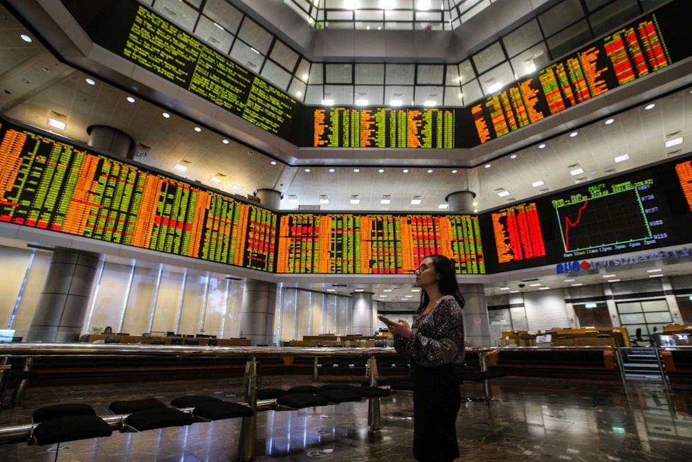 An investor monitors the stock prices in the gallery of the RHB Investment Bank Bhd headquarters in Kuala Lumpur March 17, 2020. ― Picture by Hari Anggara