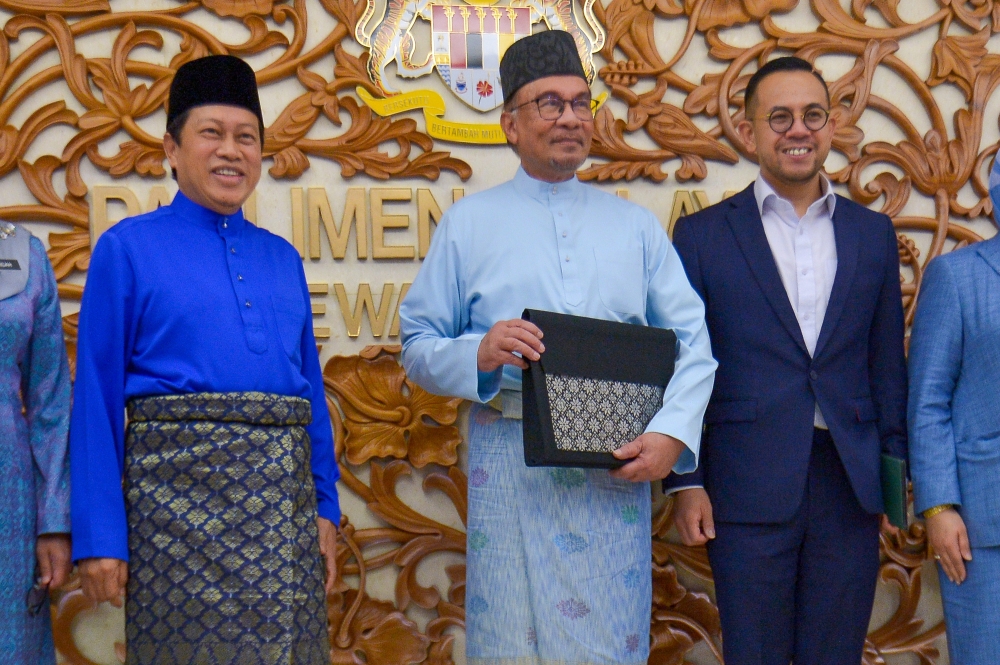 Finance minister Datuk Seri Anwar Ibrahim is pictured getting ready to table Budget 2023, in Parliament, February 24, 2023. — Picture by Shafwan Zaidon