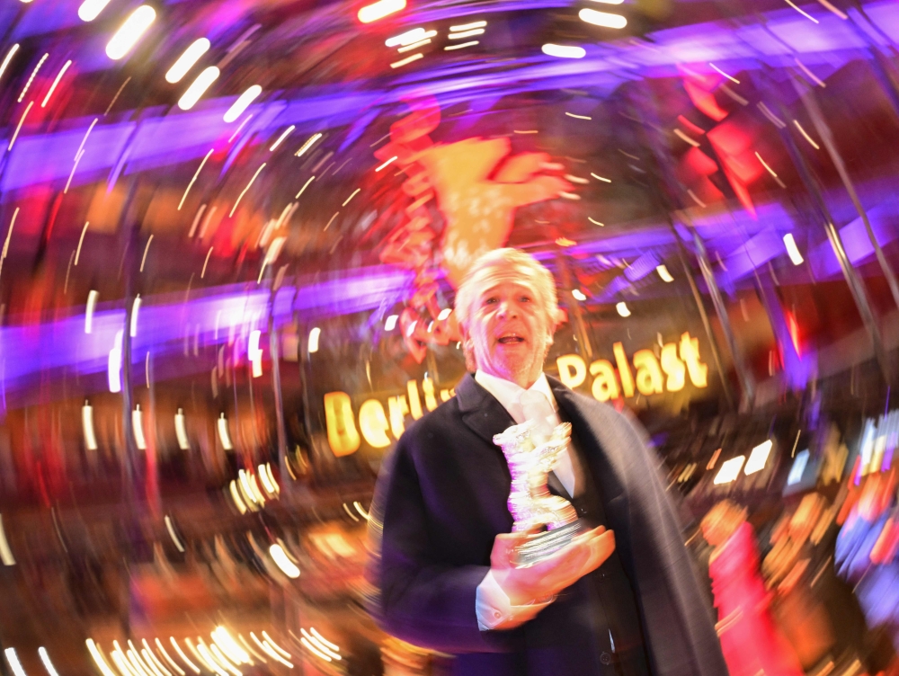 Portuguese director and screenwriter Joao Canijo poses with the ‘Silver Bear Jury Prize’ for the film ‘Mal Viver’ on the red carpet after the award ceremony of the 73rd Berlin International Film Festival in Berlin, on February 25, 2023. — AFP pic