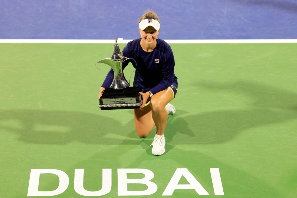 Barbora Krejcikova of the Czech Republic poses for a picture with the trophy of the WTA Dubai Duty Free Tennis Championship after defeating Iga Swiatek (not pictured) of Poland in the final match in Dubai, on February 25, 2023. — AFP pic