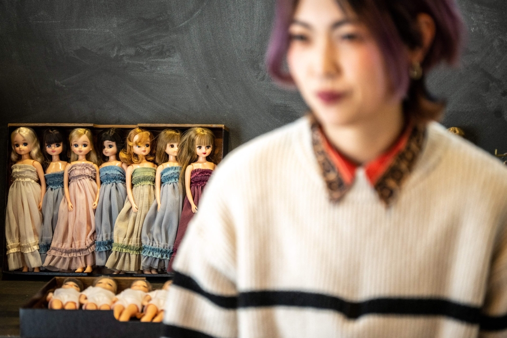 This photo taken on January 24, 2023 shows Ryoko Baba, a 33-year-old graphic designer, speaking in front of her Licca-chan collection during an interview with AFP at her home in Tarui, Gifu Prefecture. — AFP pic