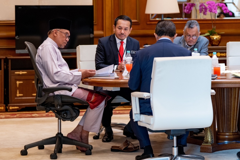 Prime Minister Datuk Seri Anwar Ibrahim on his first day in office on November 25, 2022, meeting with Chief Secretary to the Government Tan Sri Mohd Zuki Ali. — Picture by Prime Minister's Office