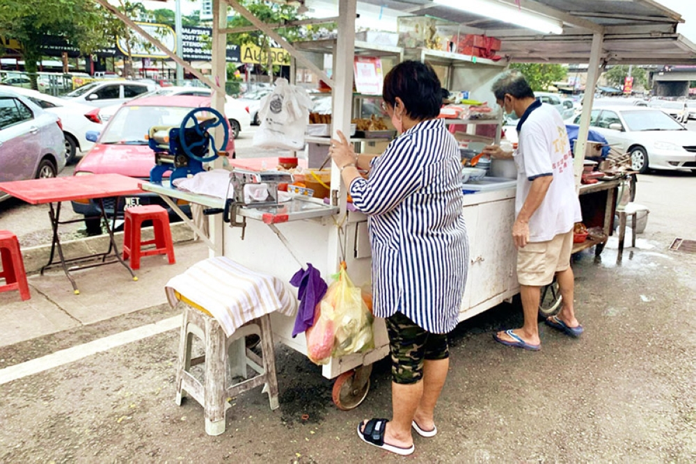 Running a busy food stall requires teamwork.