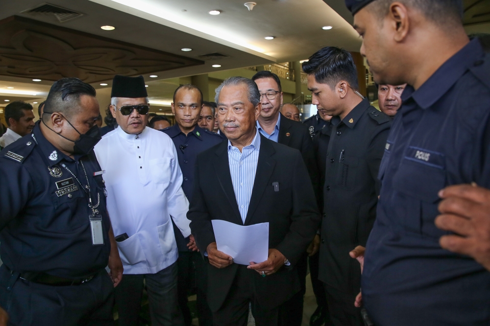 Former prime minister Tan Sri Muhyiddin Yassin reacts as he leaves the Kuala Lumpur High Court March 10, 2023. — Picture by Yusof Mat Isa