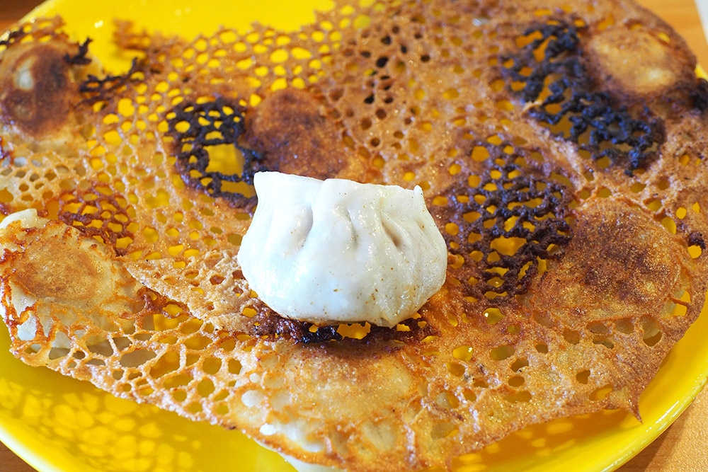 You can also order pan fried dumplings that are served with a crispy lacy skirt for extra crunch.