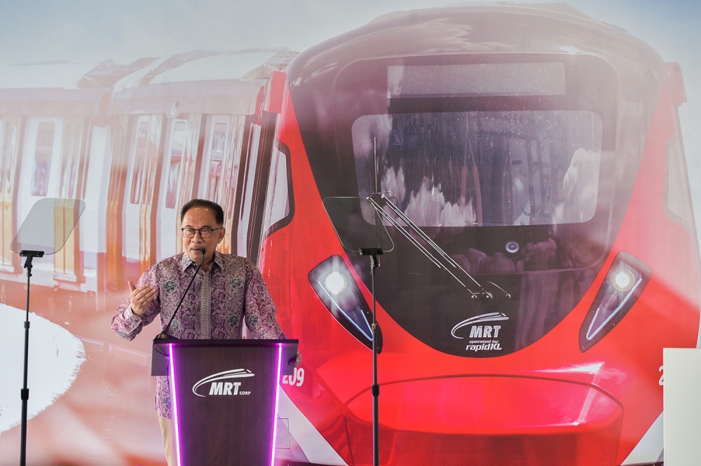 Prime Minister Datuk Seri Anwar Ibrahim speaks during the launch of MRT2 Phase Two at the Serdang Depot March 16, 2023. — Picture by Miera Zulyana