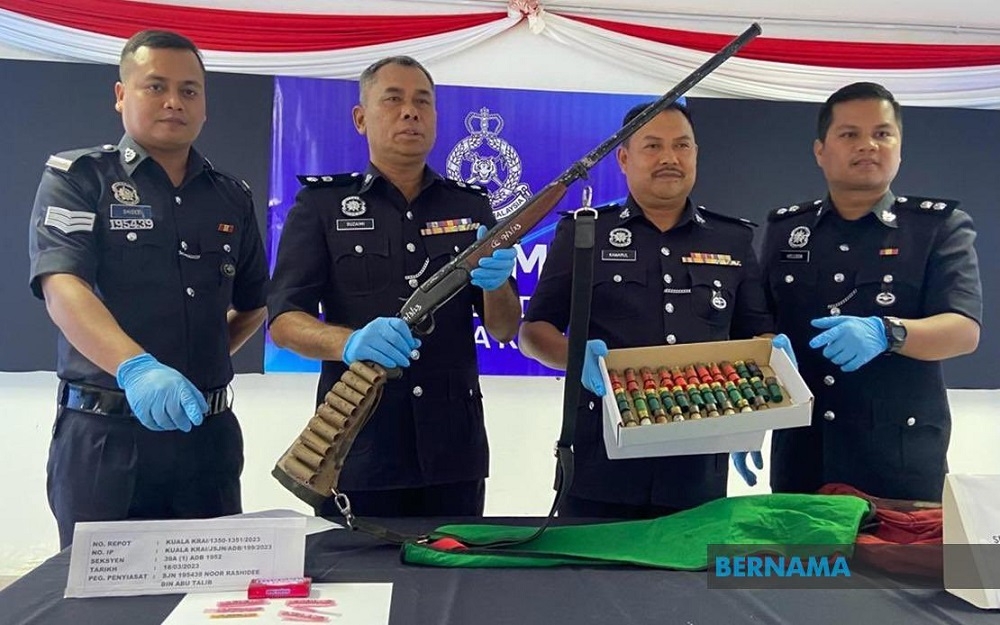 A man believed to be a drug dealer was arrested for possessing a shotgun, live ammunition and 60 ‘kuda’ (amphetamine) pills during Op Nusa on Friday. — Picture via Twitter/Bernama