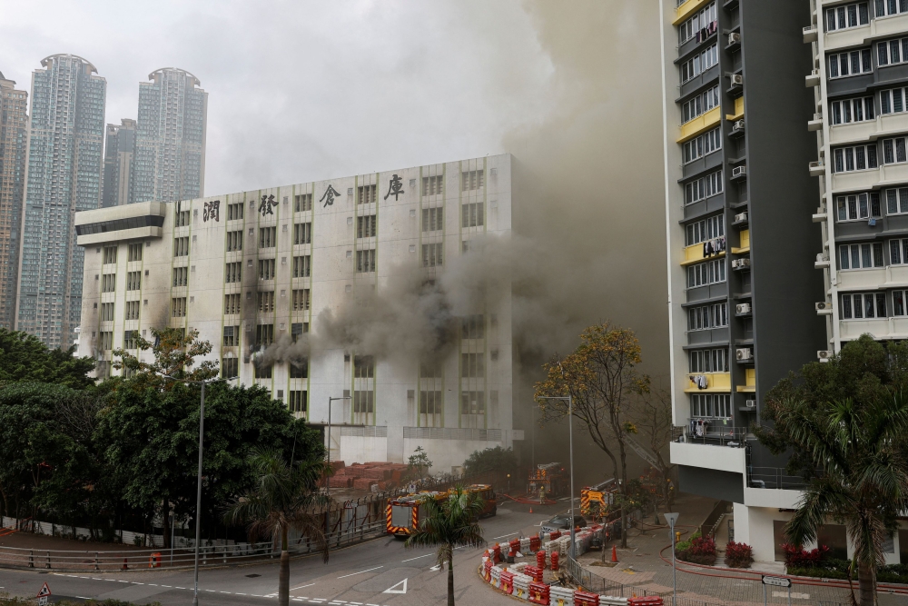 A blaze is seen at a warehouse in the city's bustling Kowloon district, in Hong Kong March 24, 2023. ― Reuters pic