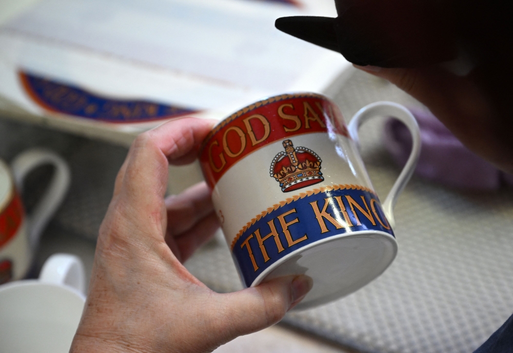 The bold red, white and blue design incorporates the Tudor crown of English monarchs from the time of Henry VIII with the words “God Save The King” in large gold letters. — AFP pic