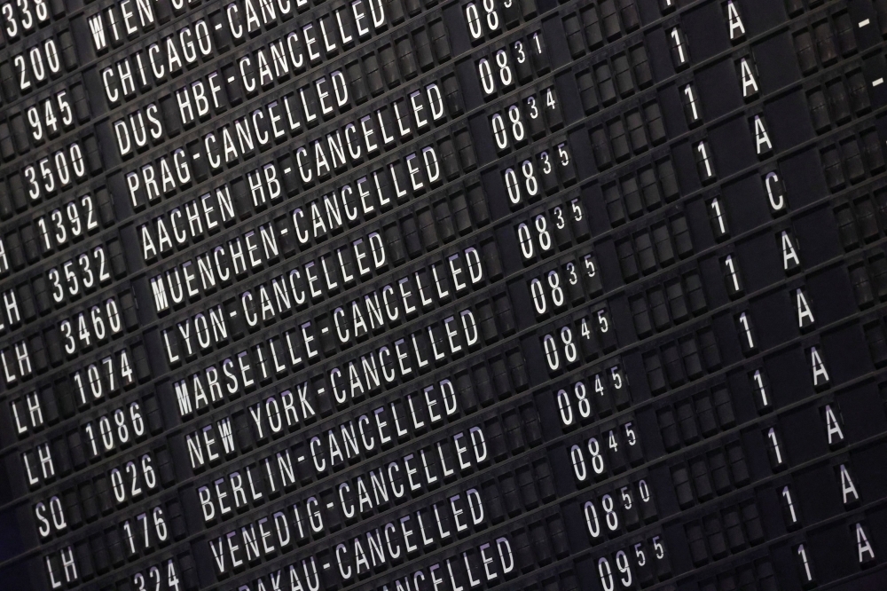 A display board shows the list of cancelled flights at Frankfurt airport during a nationwide strike called by the German trade union Verdi. — Reuters pic