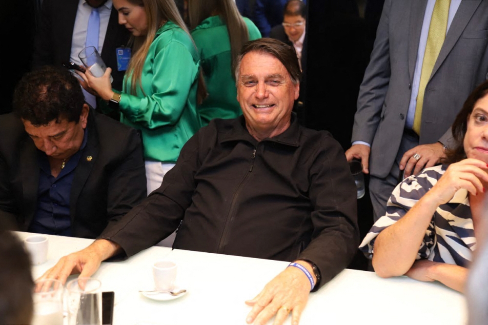 This handout picture released by the Brazilian Liberal Party shows former Brazilian President Jair Bolsonaro gesturing during a meeting with the party's lawmakers at the Liberal Party headquarters in Brasilia on March 30, 2023. — Picture by Handout / Liberal Party / AFP