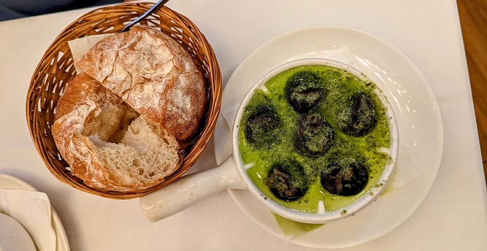 Baked escargots with some fresh bread, each morsel more delicious than the last.