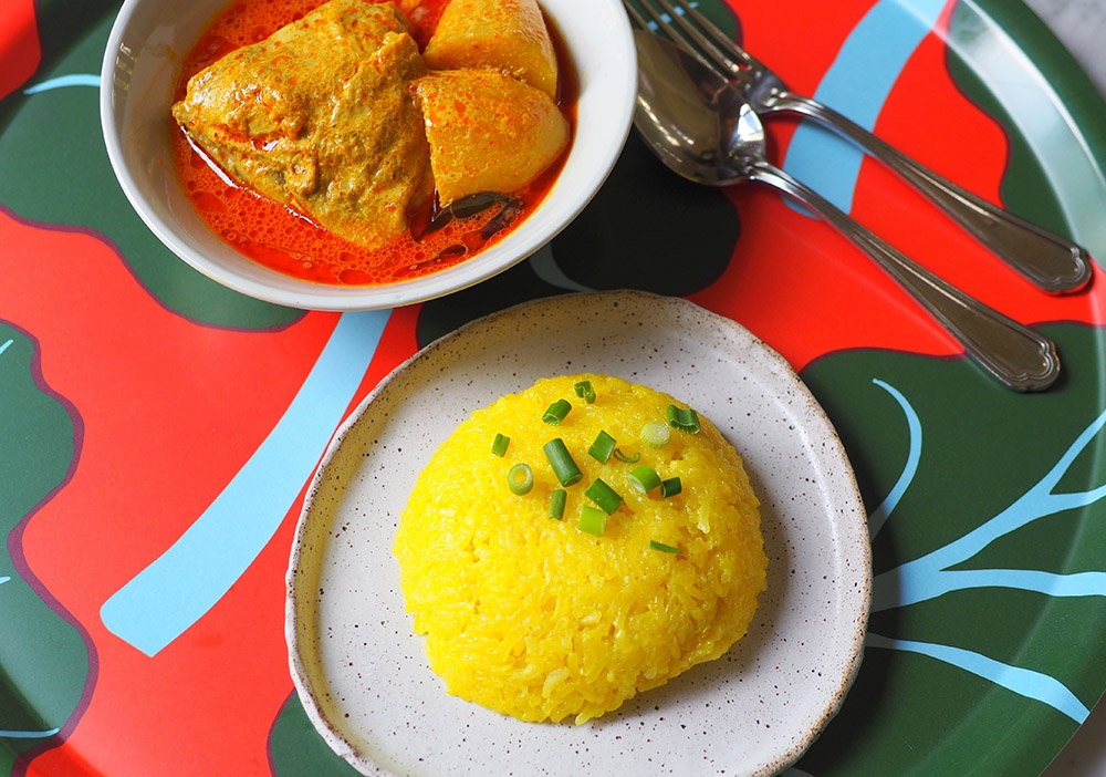 The 'nasi kunyit' pairs beautifully with the Nyonya curry chicken.