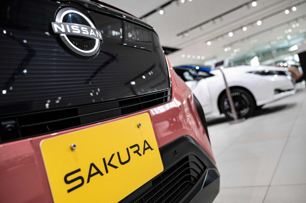 One of Nissan's electric vehicles (EV), the Sakura, on display at the global headquarters of Japanese automaker Nissan Motor in Yokohama, Kanagawa prefecture. — AFP pic