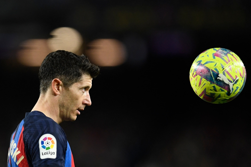 Barcelona's Polish forward Robert Lewandowski stares at the ball during the Spanish league football match between FC Barcelona and Girona FC at the Camp Nou stadium in Barcelona on April 10, 2023. — AFP pic